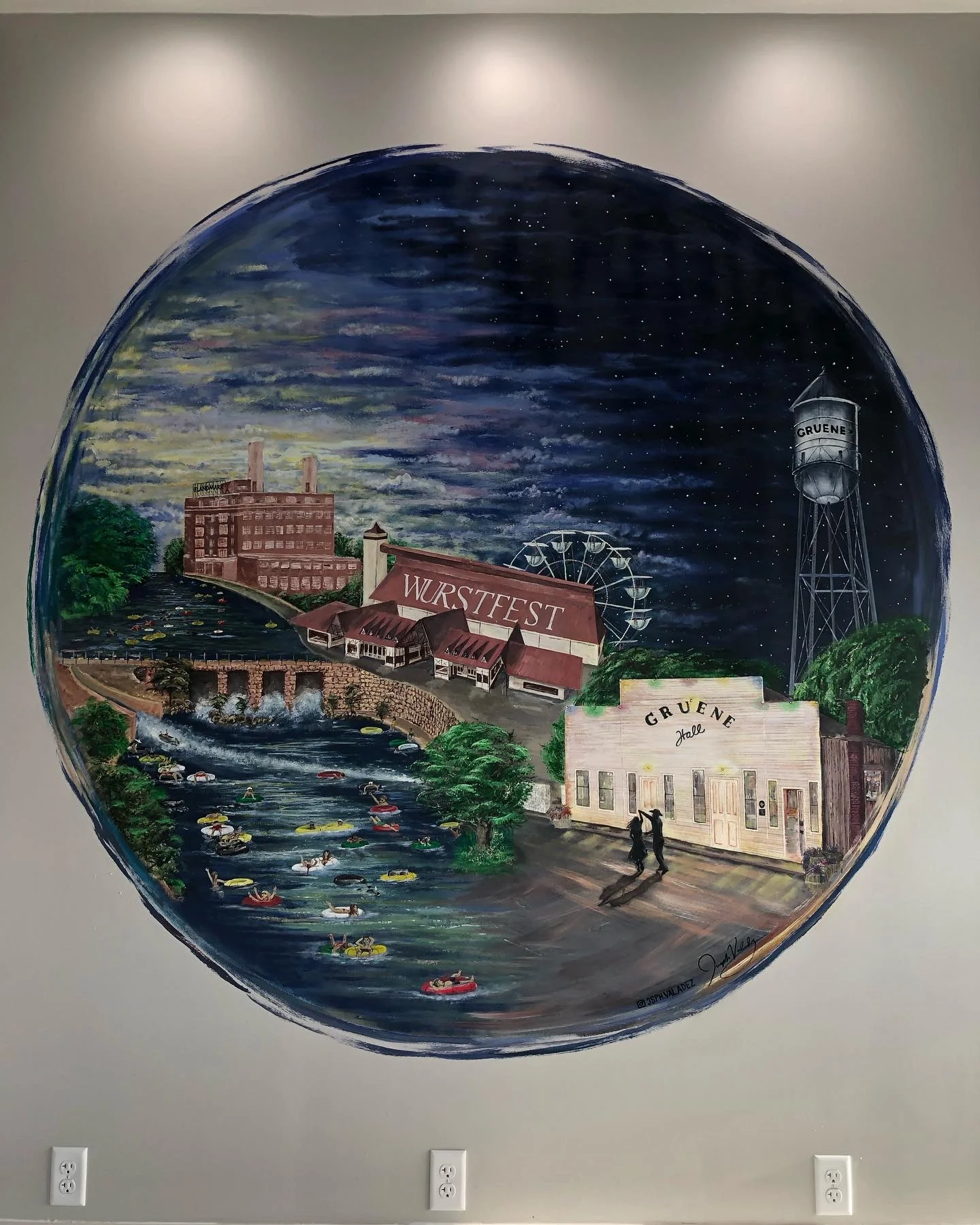 Completed circular iCRYO New Braunfels mural by Joseph Valadez